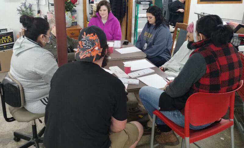 A group of members sitting together around a table